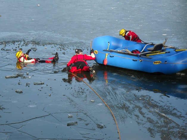 East Pierce firefighters practice ice rescue techniques Friday at Lake Tapps.