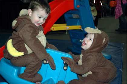 Enumclaw brothers Ben and Jack Lillis were monkeying around Saturday at the city of Enumclaw's kids Halloween party a the Enumclaw Expo Center.