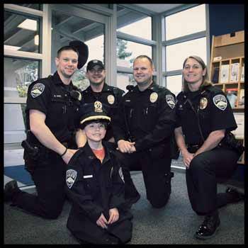 Chief for a day William Knight poses with members of the Bonney Lake Police Department.