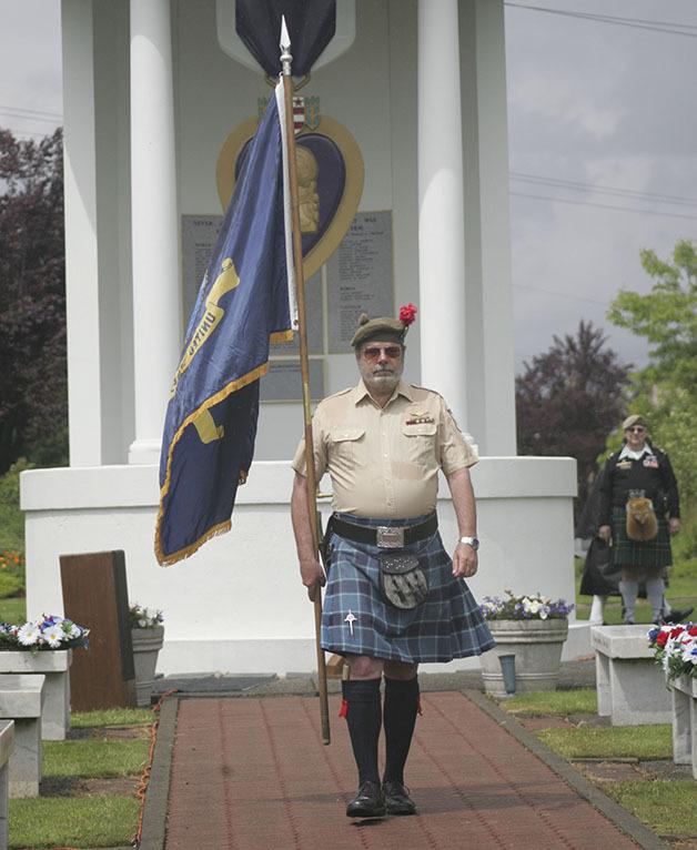 James Ellrod presented the U.S. Navy flag at the Memorial Day program May 26 at the Enumclaw Veterans Memorial Park.