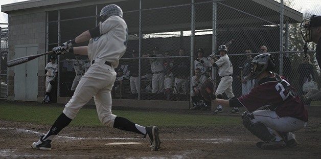Bonney Lake's Michael Gretler swings for the fence during the Panthers league game Wednesday against Enumclaw. Gretler scored two for the Panthers with his home run in the third inning.