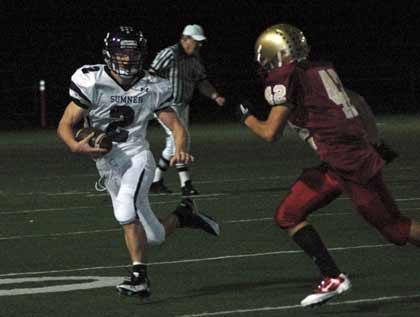 Tyler Salisbury scoots past a White River defender Friday.