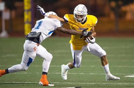 Sumner's Tre Weed slips past a Graham-Kapowsin defender and gains additional yards during last Thursday night's victory.