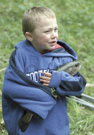 Four-year-old Chase Campbell pulled out a whopper at the 70th  annual Kiwanis fishing derby  Saturday at the Rainier School  man-made lake in Buckley. His  parents
