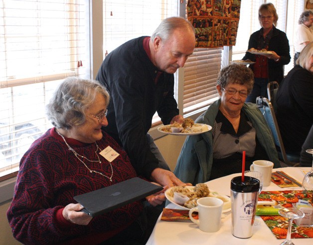 Volunteers serve Thanksgiving dinner at the Bonney Lake Senior Center Nov. 15.
