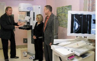Dr. David Rice shows Enumclaw Regional Healthcare Foundation leaders Megan Farr and Alan Predmore the hospital’s latest mammography unit.
