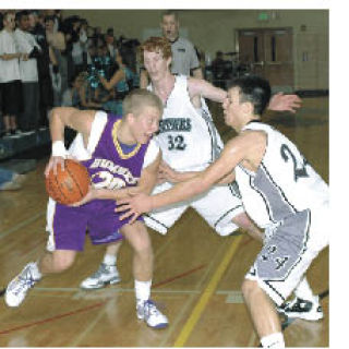 Sumner’s Jordan Bone is surrounded by Bonney Lake’s Chad Marquez and Nathan Braun.