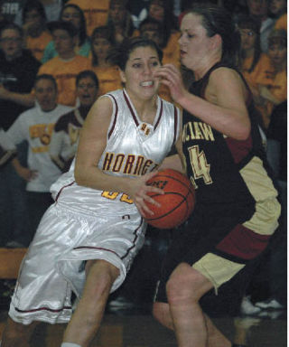 White River’s Kristina Quintanilla attempts to drive past Enumclaw’s Heather Hitch during Friday night action.