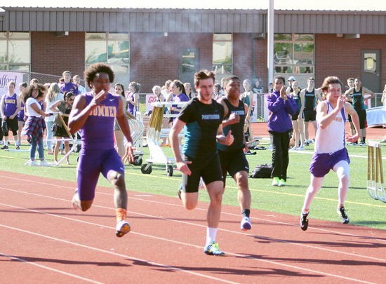 Panther Bennett Hillier pulls ahead of Spartan Connor Wedington during the 200-meter sprint at the April 7 meet at Sunset Chev Stadium.