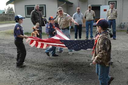 Cub Scouts from Pack 500 and Boy Scouts from Troop 422 helped the Enumclaw Veterans of Foreign Wars Post No. 1949 retire flags Sunday. Approximately 25 American flags were part of the ceremony which retires Old Glory with honor and dignity. The post collects flags throughout the year. Flags can be taken to the post or dropped at Radio Shack in Enumclaw.