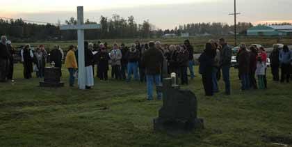 Community members gathered Nov. 1 at Holy Family Cemetery