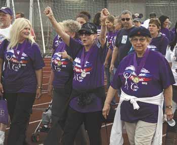Participants in this year's Sumner/Bonney Lake Relay For Life cheer during the Survivor Lap.