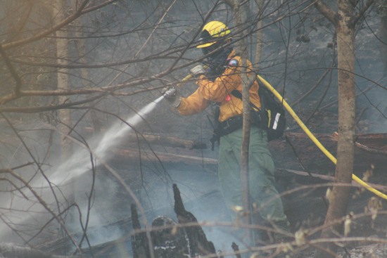 Firefighters were dousing the area around Panorama Heights and The Summit to prevent any flare-ups.