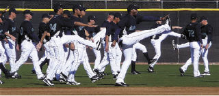 Seattle Mariner warm up before practice starts. Ken Griffey is the high kicker leading the pack.