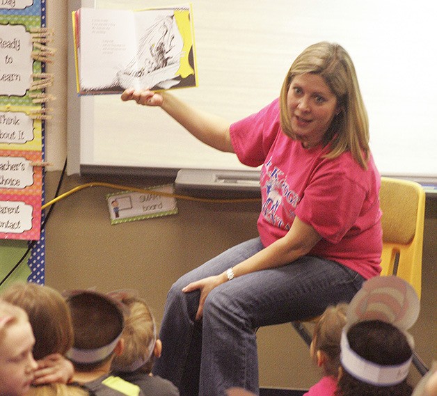 Elk Ridge Elementary students listen to kindergarten teacher Heidi Lee read a Dr. Seuss story.