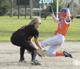 Kassi Young attempts to take out an Auburn Mountainvew runner sliding into second base. The runner was safe.