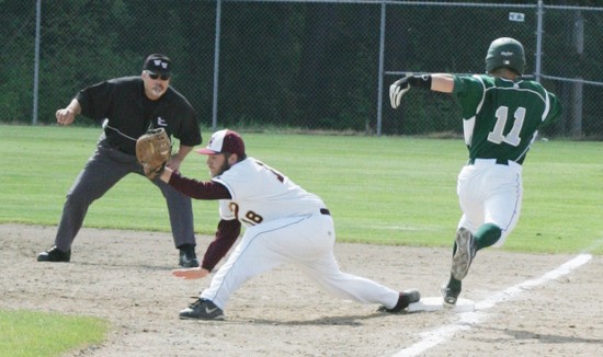 White River’s Joe Lacy stretches for a throw to nip a Port Angeles runner at first. The action came Thursday during the Hornets’ season finale.
