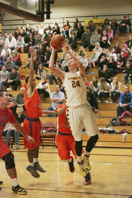 Enumclaw's Josh Erickson gets around Graham's defense and goes for the hoop.
