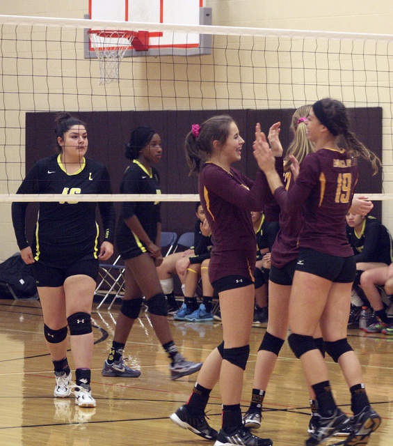 The Enumclaw Hornets celebrate a point against Lincoln High School.