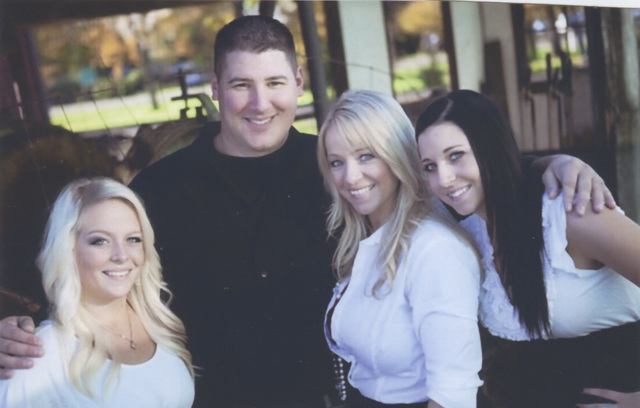 Tony Ryan with his wife Kari (middle) and daughters Allie (right) and Jessica (left).