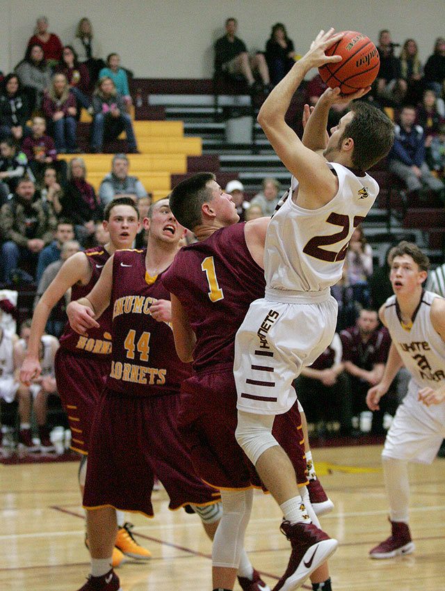 The Hornets faced off last Friday, with Enumclaw barely squeaking by with a win 53-52 over White River. Photo by Dennis Box.