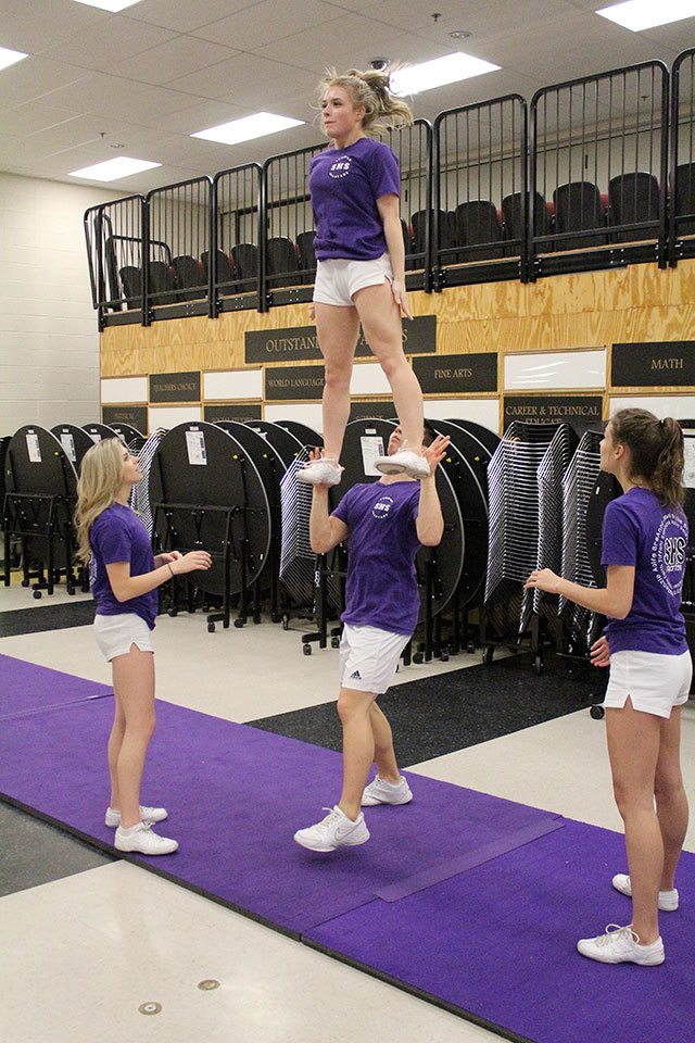 Tiffani Terhune excels at tumbling, but is learning how to be lifted for group stunts. Photo by Ray Still.