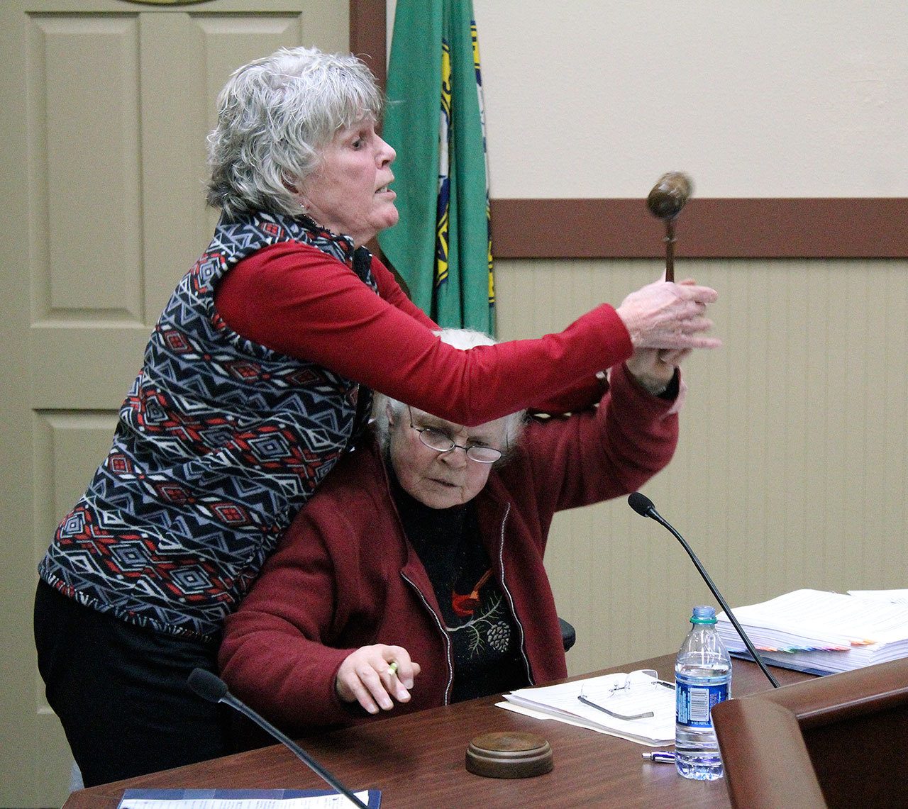 During a recess called by Mayor Benson, Mayor Pro Tempore Erika Morgan took Benson’s seat as chair and attempted to continue the council meeting. Benson wrested the gavel from Morgan as Black Diamond police officers stepped in. Photo by Ray Still.