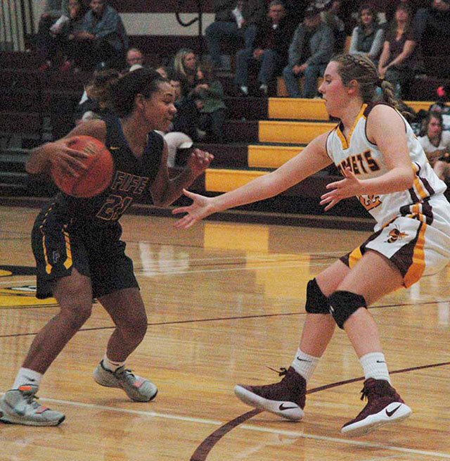 White River’s Georgia Lavinder tries to stop Fife’s advance during last Friday’s game. The Hornets came away with a 70-26 win. Photo by Kevin Hanson.