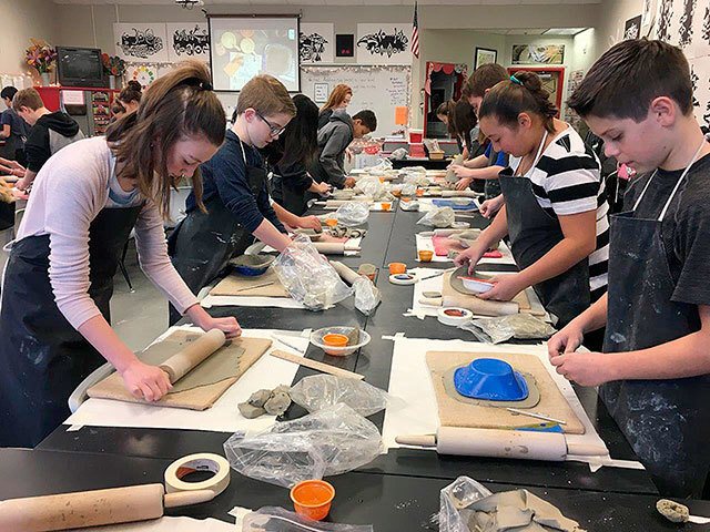 Saige Aarstad, Nick Rezek, Charles Jones, Alyssa Retchless and other students working hard on making bowls for the upcoming Empty Bowls event. Photo courtesy of Danise Lakin.