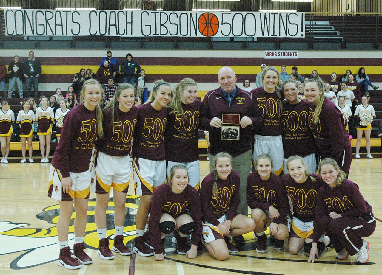 Chris Gibson with the White River High School&rsquo;s girls basketball team. Photo by Kevin Hanson.