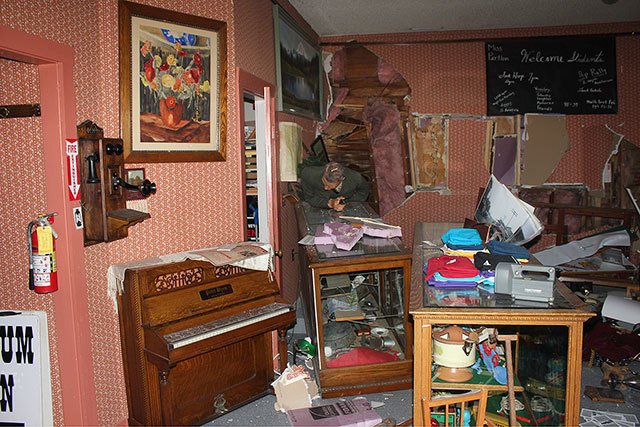 The damage inside the museum after the car hit the load-bearing wall. Photo courtesy of the Buckley Foothills Museum.