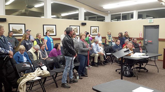 Black Diamond City Council meetings continue to be a spectator sport, with the audience often making comments to the council or, in this case, standing to show opposition to the majority council. Photo by Ray Still.