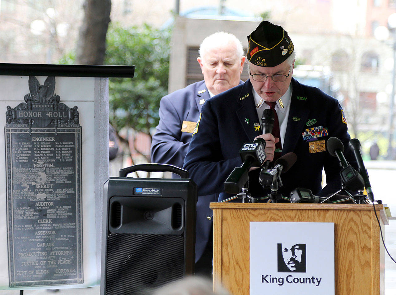 Tom Krueger leads a prayer during last week’s ceremony as Al Zarb looks on. Both are members of Enumclaw’s VFW Post 1949. Photo courtesy of King County.