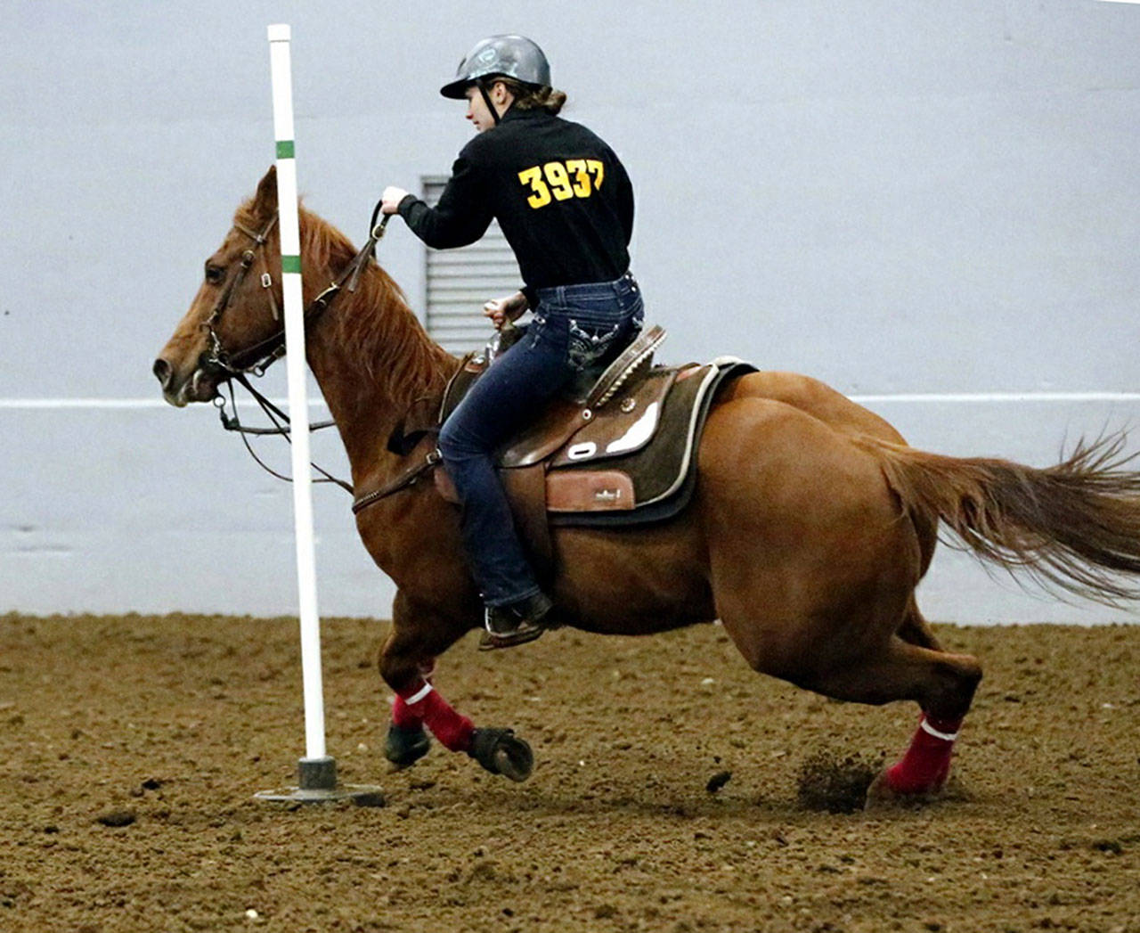 Enumclaw’s Emma Schmidt on the way to a district record in pole bending. Contributed photo.