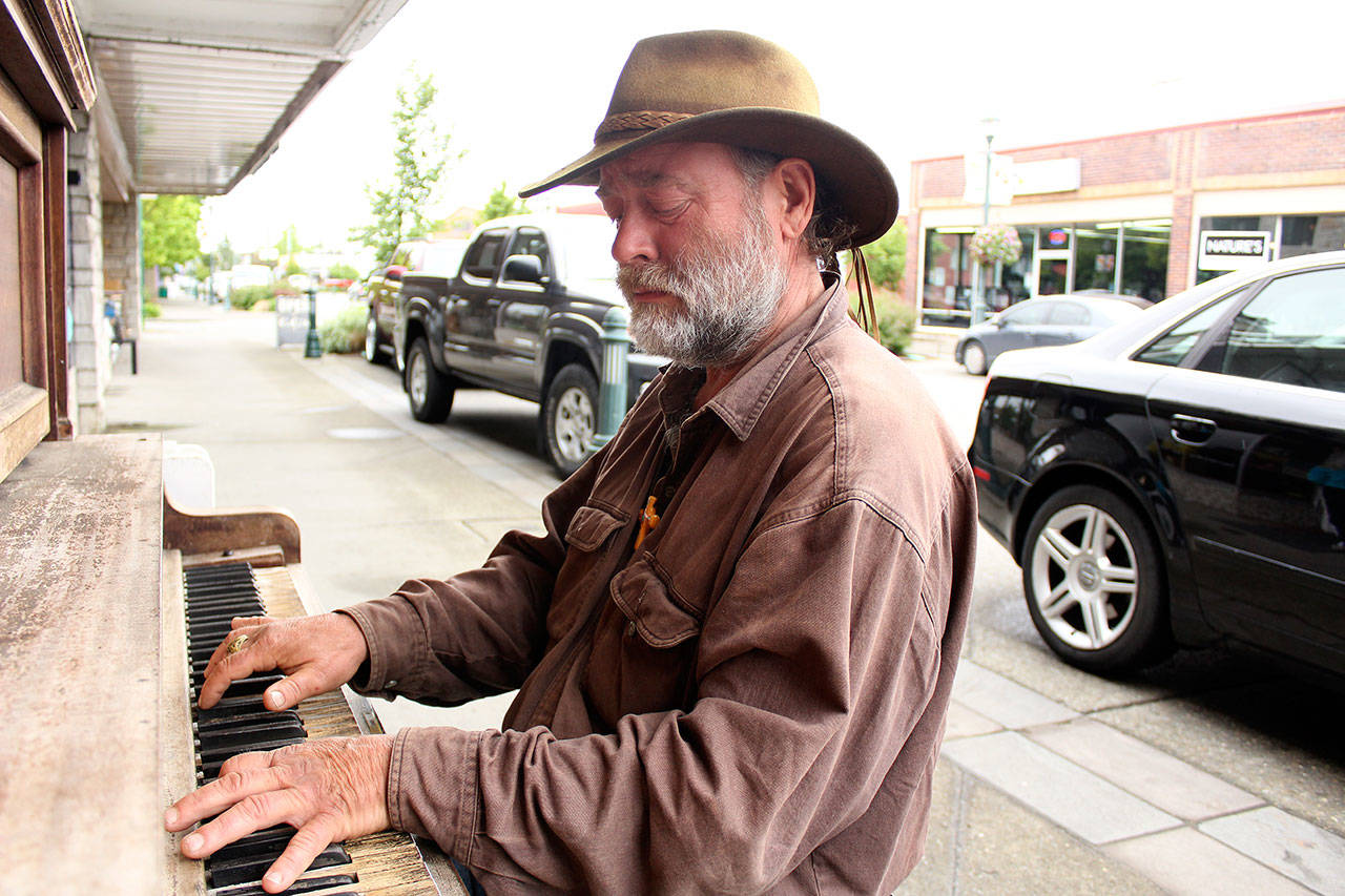 Allen Miller, an Enumclaw local, has been homeless for several years. He can sometimes be found improvising on the piano on Cole Street at night. Photo by Ray Still.