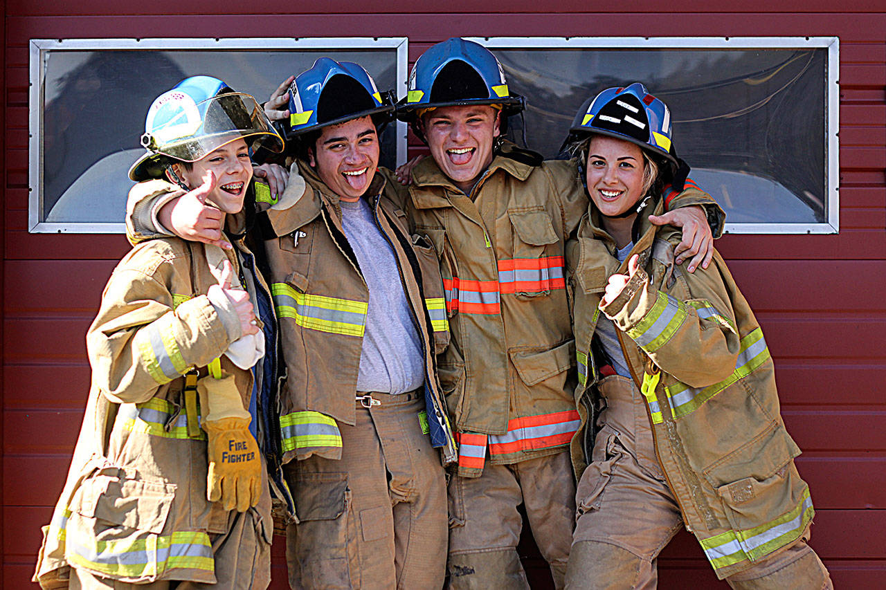Left to right, John Whitmore, Diego Santiago, Justin Thompson and Tyanna Cole of Zone 3 Explorers strike a pose at Maple Valley Fire Station 81. Photos by Leah Abraham, Renton Reporter