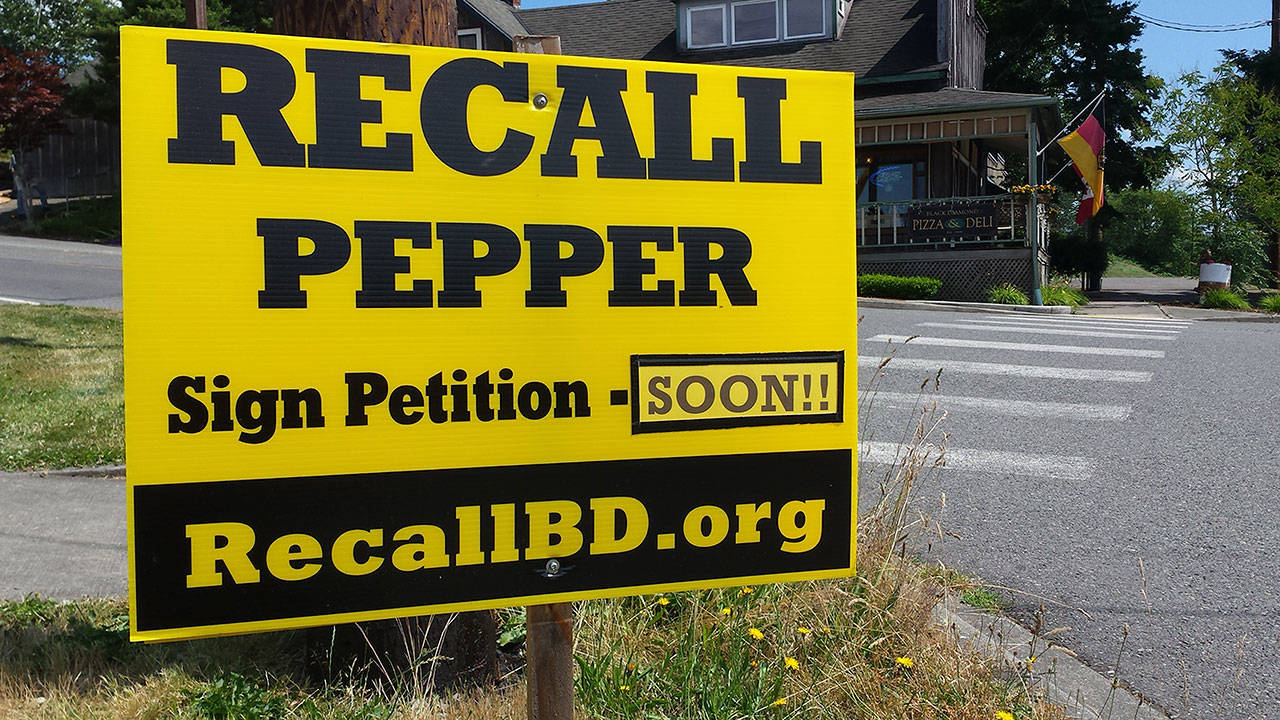 Political signs calling for Councilwoman Pat Pepper’s recall can be found scattered around Black Diamond. Photo by Ray Still