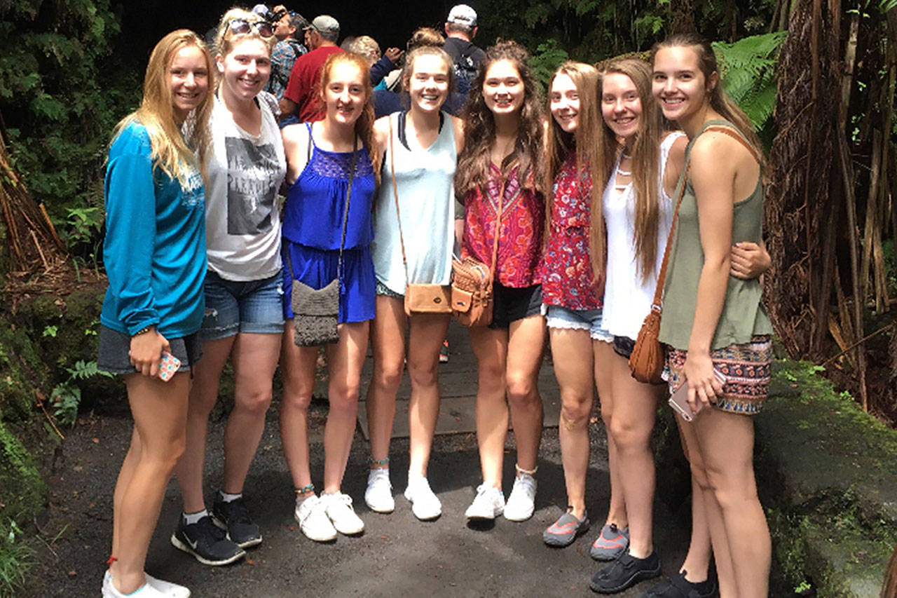 The champion team from White River consisted of, from left: Chloe Narolski, Taylee Goethals, Kara Marecle, Taylor Schmidtke, Sam Fiedler, Sofia Lavinder, Georgia Lavinder and Dee Dee Forsman. Here, the group takes a break from basketball and plays tourist at a Hawaiian volcano. Submitted photo