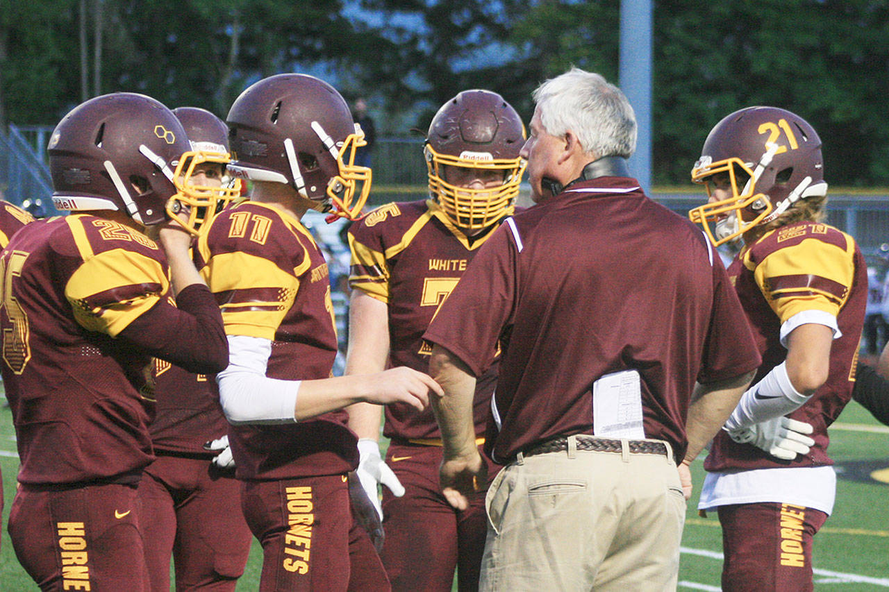 Coach Jeff Zenisek offers some direction to his offense during a game last year. Included was quarterback T.J. Stroschein, who is back as a starter in his sophomore season. File photo by Kevin Hanson
