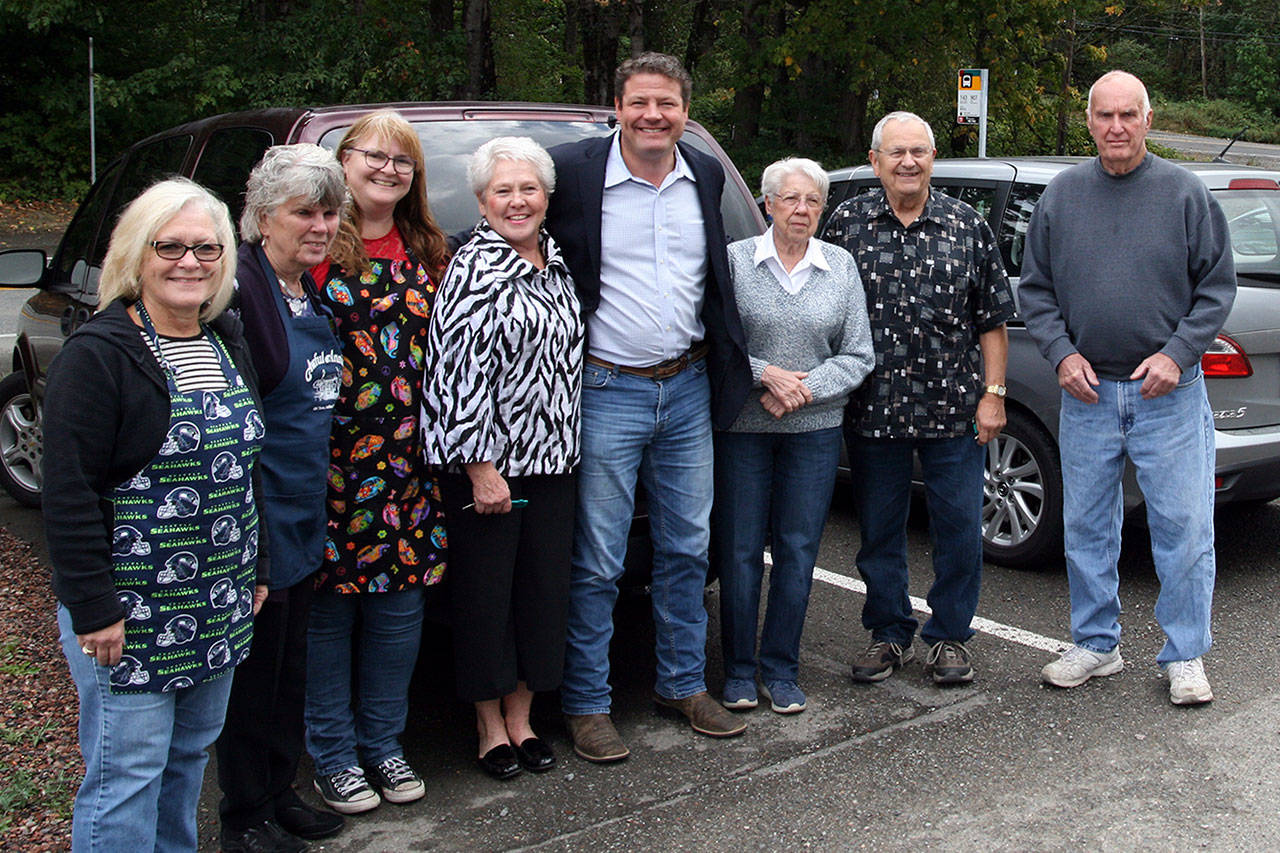 Councilmember Reagan Dunn is joined by Executive Director Cheryl Hanson (4th from the left), staff and clients of the Black Diamond Community Center after dropping off a surplus Metro Transit Vanpool van to the Center. Submitted photo