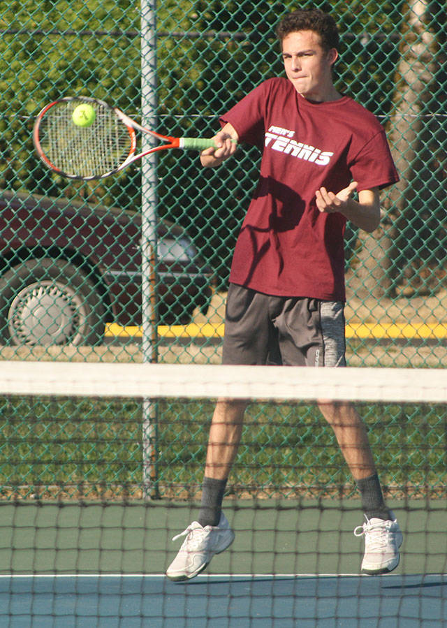 Brennan Gallagher faces the Raven’s No. 2 singles player. Photo by Kevin Hanson.
