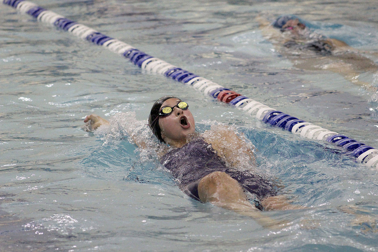 Olivia Castro starts the second half of her lap during the district 200 yard medley event. Her relay team, also consisting of Mikaela Miele, Marin Wilson and Emma Huynh, placed sixth in the event and will compete at state. Photo by Ray Still
