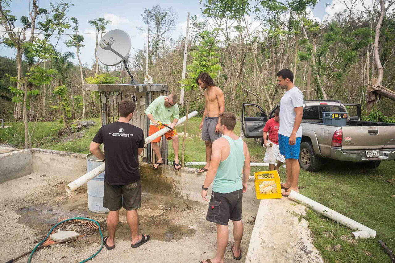 Enumclaw’s Tyler Gachen and Ryan Wood are helping Puerto Ricans get access to fresh water by installing large, stream-fed filtration systems in communities that were hit hard by hurricane Maria. Photo credit Sara Armas