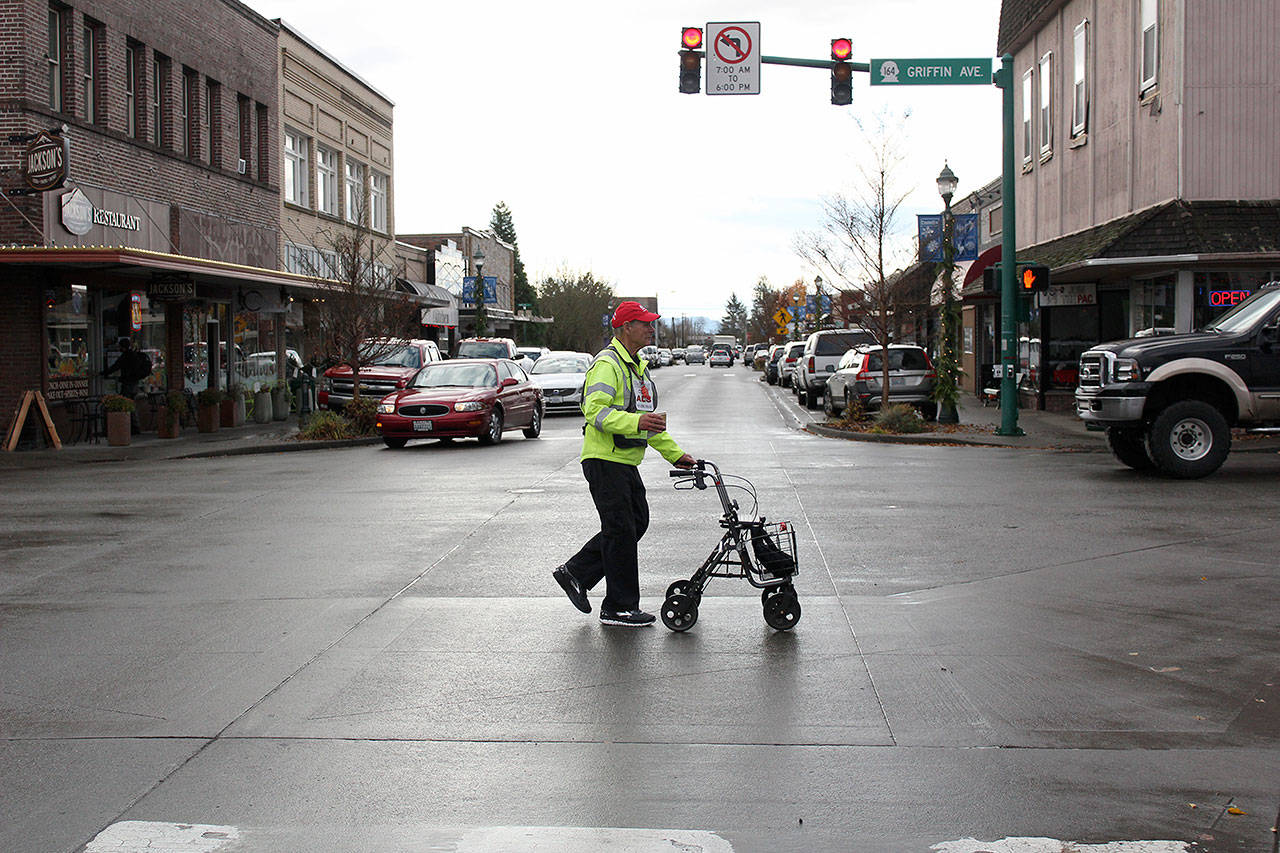 After his interview, Don Stevenson  the Pacing Parson  went straight back to walking SR 164 to Auburn. Hes averaging 14 miles a day, but hopes to bring his pace back up to 30 in the near future. Photo by Ray Still