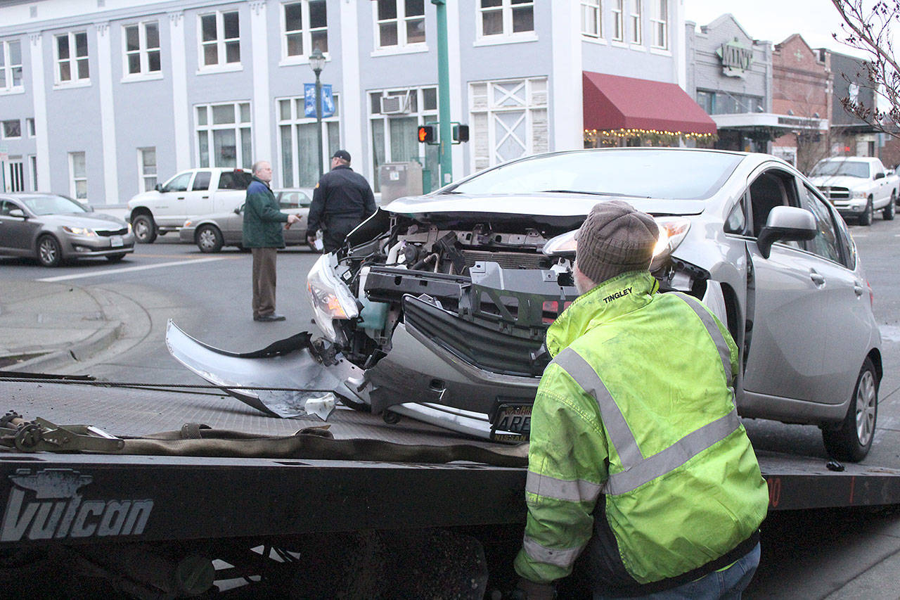 A silver Nissan struck a grey Honda in Enumclaw on the morning of Jan. 4, when the Honda ran the red light at the SR 164 and Cole St. intersection. No injuries were reported. Photo by Ray Still