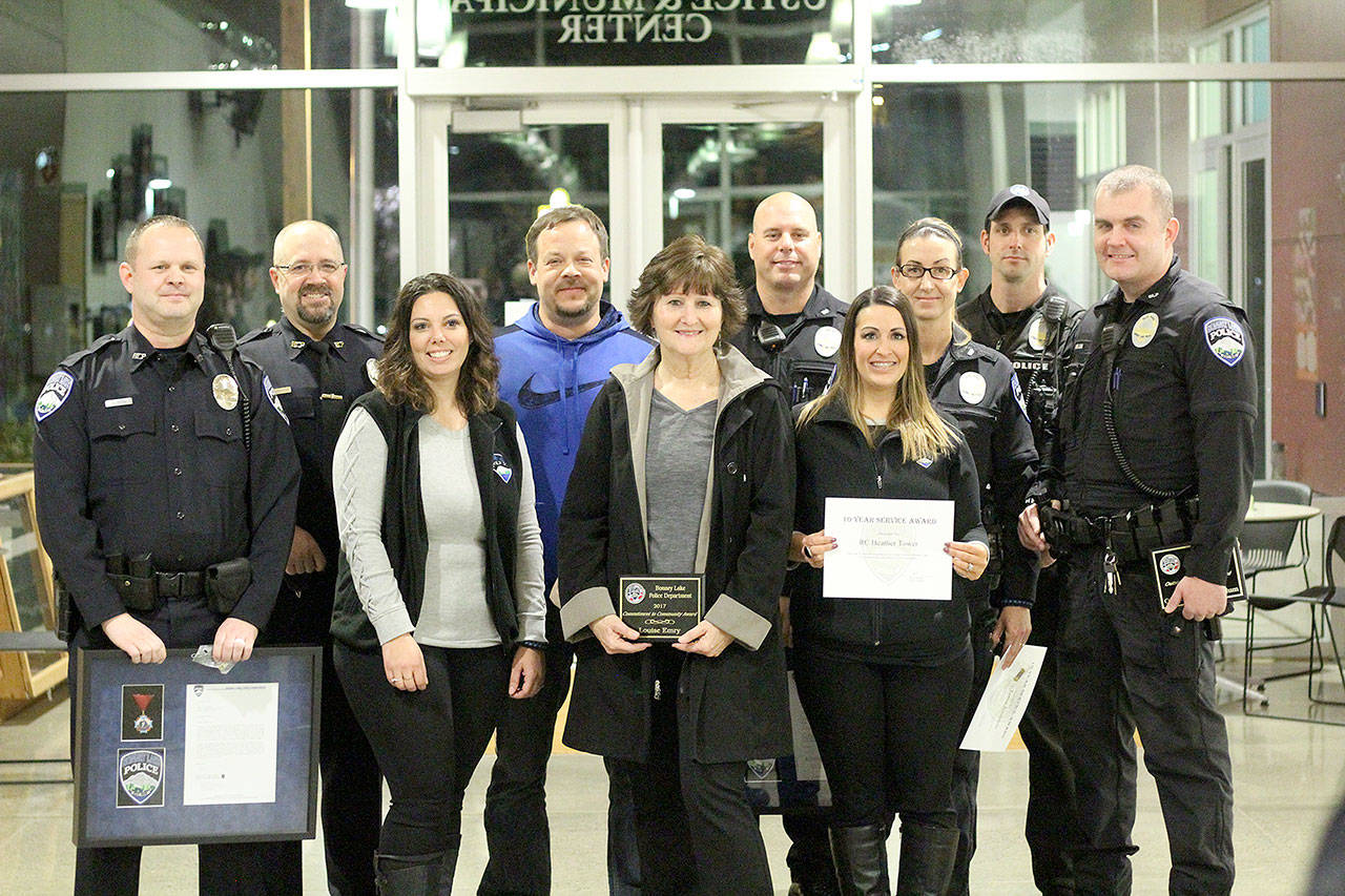 Ofc. Todd Green, Sgt. Tom Longtine, records clerk Jaime Amsbaugh, Det. Kyle Torgerson, admin assistant Louise Emry, Sgt. Rob Hoag, records clerk Heather Tower, Ofc. Tobie Johnston, Ofc. Eric Alfano, and Ofc. Buddy Mahlum. Photo by Ray Still