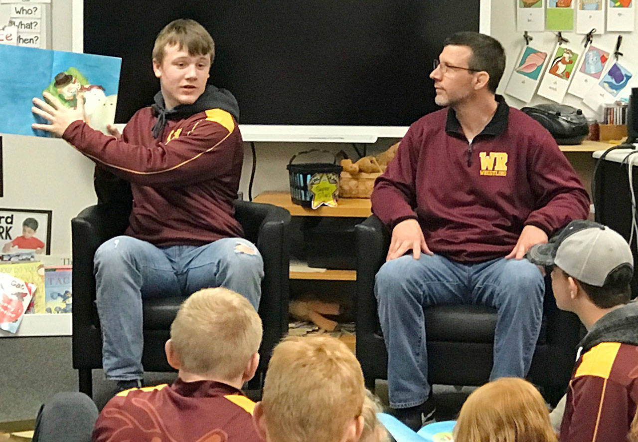 White River wrestlers share books with first-graders