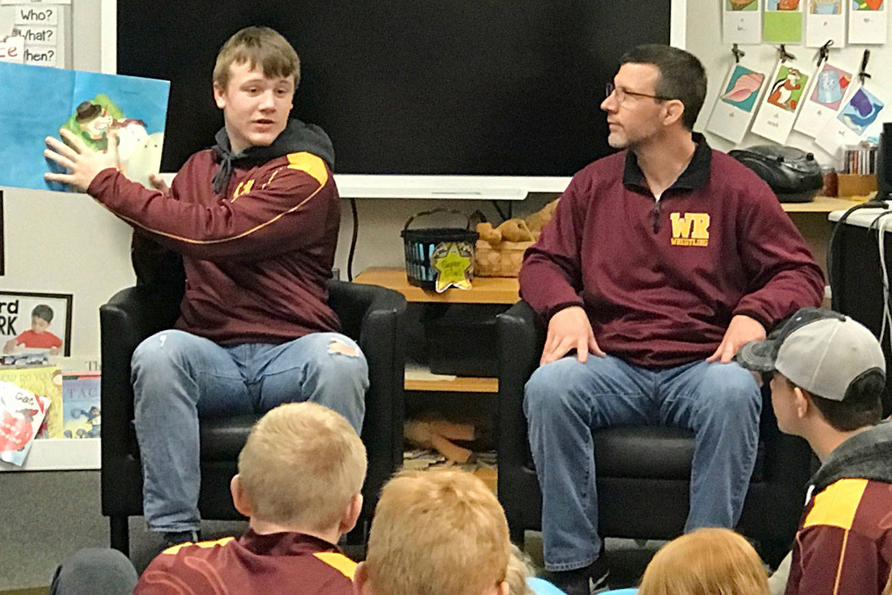 White River wrestlers share books with first-graders