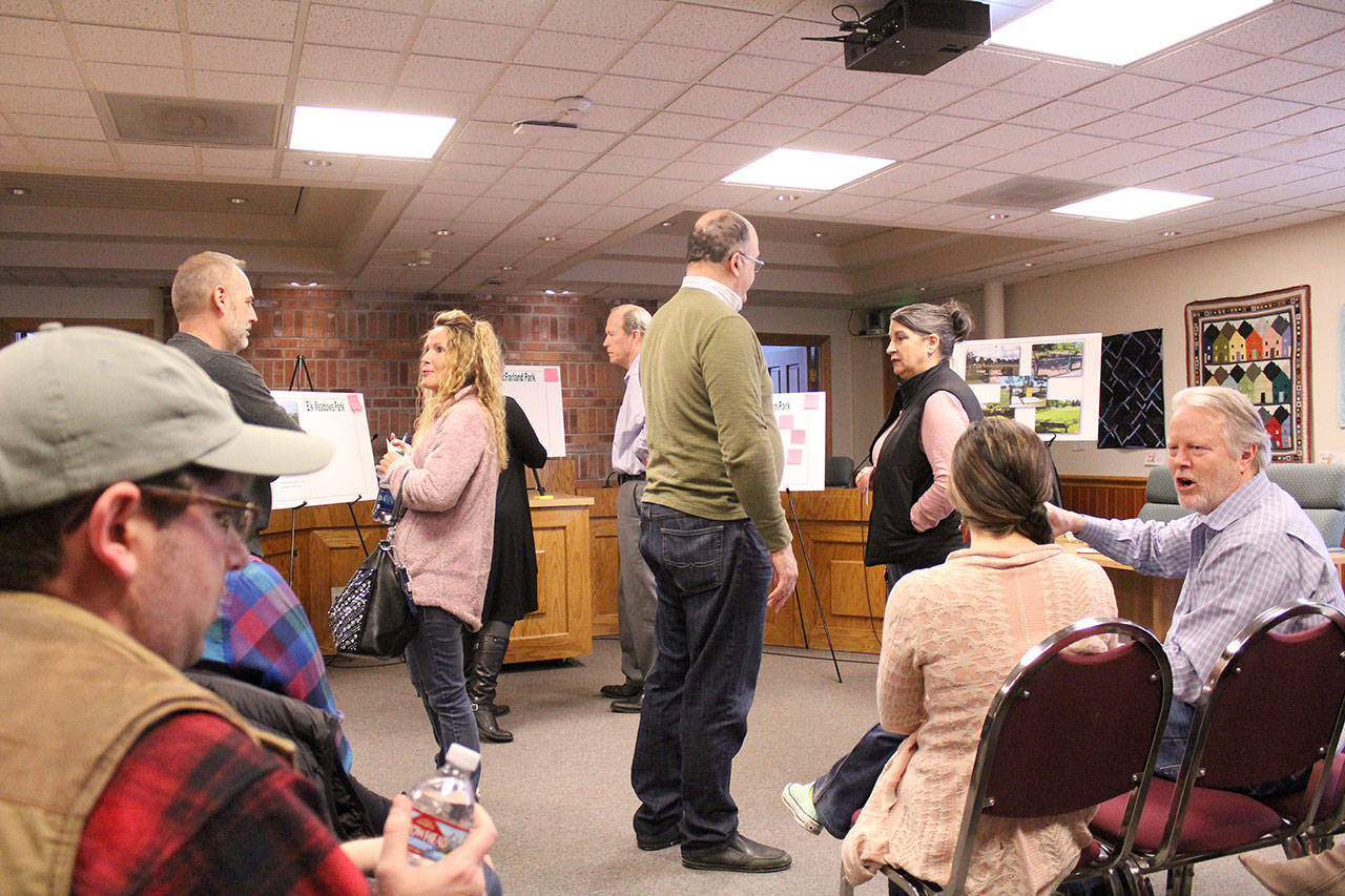 A small group of Enumclaw residents attended the March 14 open house for the city’s future dog park, which was hosted by Enumclaw’s Park Board. Photo by Ray Still
