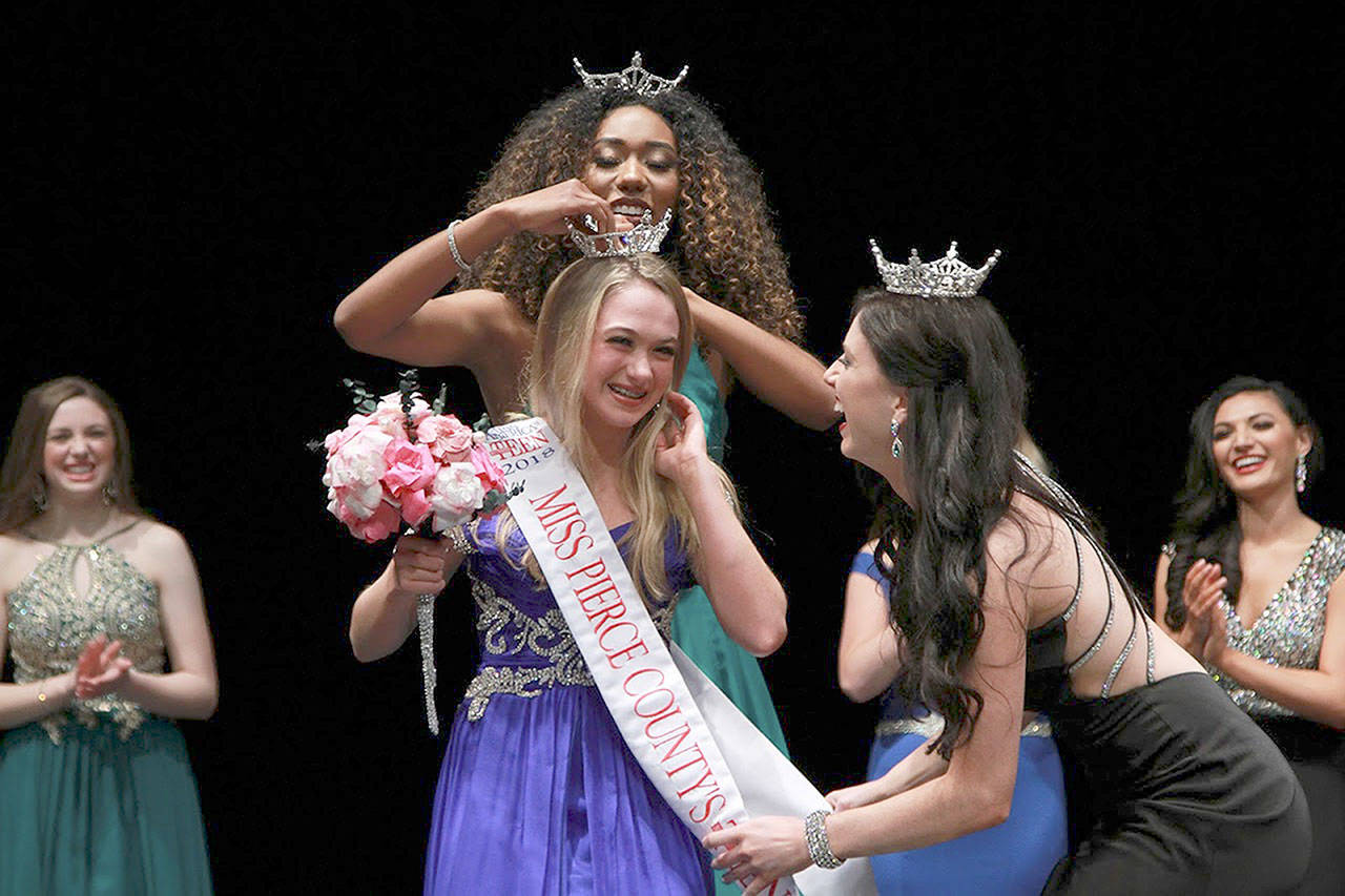 Chloe Furnstahl is crowned Miss Pierce County Outstanding Teen by last year’s title holder, Charissa Bacon of University Place, Washington. Photo by Matt Wuscher.